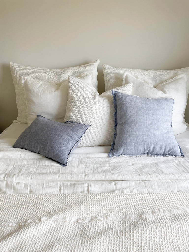 https://www.anayahome.com/cdn/shop/files/chambray-blue-so-soft-linen-pillows-1_1024x1024.jpg?v=1693278045